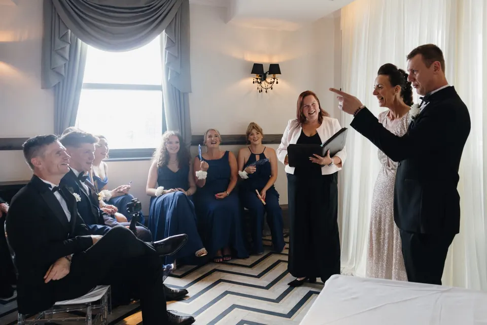 Sarah leading Eve and Michael's wedding ceremony