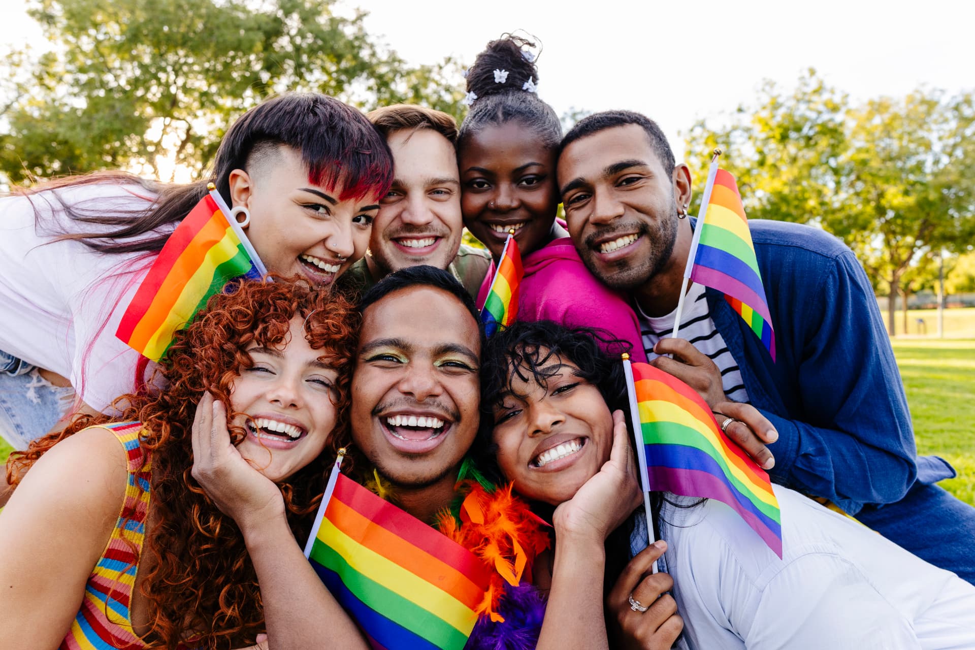 Friends celebrating together with Pride flags