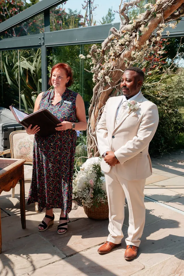 Sarah standing beside the groom during the ceremony